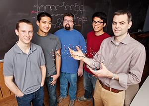 Chemistry professor Martin Burke holds a model of amphotericin. (Photo by L. Brian Stauffer.)