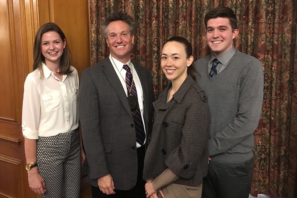 Benjamin Hankin, second from left, with students after an investiture ceremony honoring him as the Fred and Ruby Kanfer Professor of Psychology. 