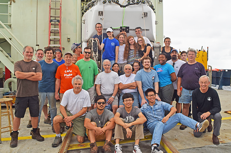 Members of the multi-institutional OASIS Expedition, led by the University of Illinois, pose for a photo. (Photo courtesy of P. Gregg [Illinois], D. Fornari [WHOI], and M. Perfit [University of Florida], co-chief scientists of OASIS cruise AT37-05 on R/V Atlantis funded by the National Science Foundation.) 