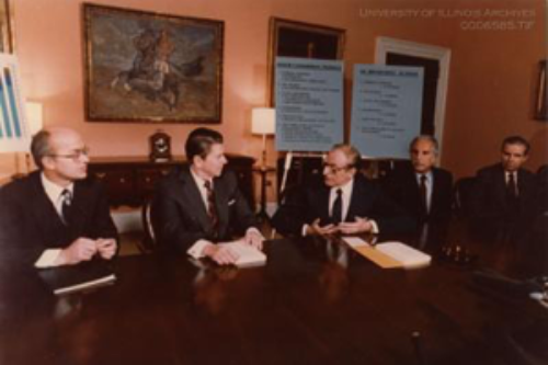A 1982 press conference included Secretary of the Interior James G. Watt (far left), President Ronald Reagan (center left), and Chair of the Commission of Fiscal Accountability of the Nation’s Energy Resources David F. Linowes (center). (Image courtesy of the U of I Archives.) 