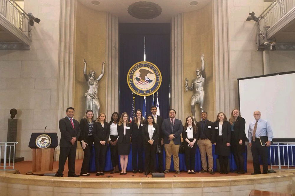 Students in a new LAS course, pictured here, met with many U of I alumni in Washington, D.C., including William Brighton (BA, ‘73, French), far right, an assistant section chief at the U.S. Department of Justice. (Photo courtesy of Melissa Schoeplein.) 
