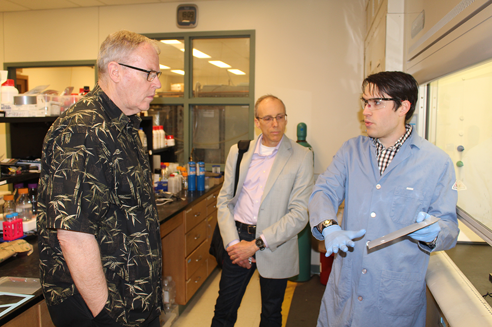 From left: Bob Work, U.S. Deputy Secretary of Defense; Jeffrey Moore, director of the Beckman Institute and the Murchison-Mallory Professor of Chemistry, and Ian Robertson, from the Department of Materials Science and Engineering, during Work’s tour of Illinois over Commencement Weekend.