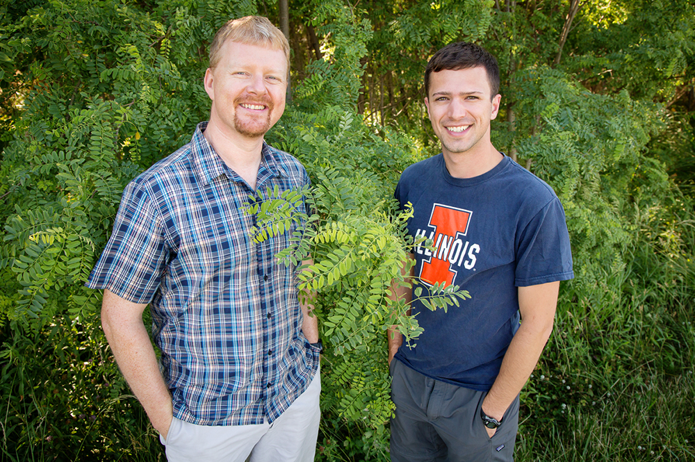 Researchers at the U of I found that plants vary a lot in the efficiency with which they uptake carbon dioxide and conserve water. Plant biology professor Andrew Leakey, left, mentored Kevin Wolz, who was an undergraduate at the time he conducted the research. Wolz now holds degrees in civil engineering and biology and is pursuing a doctorate in biology.