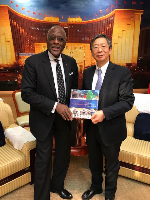 Yi Gang, right, has been appointed the next governor of the People’s Bank of China. He is shown here with University of Illinois at Urbana-Champaign Chancellor Robert Jones, in November 2017. 