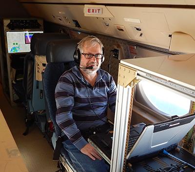 Bob Rauber, head of atmospheric sciences at Illinois, sits at the chief scientist station in the NSF/National Center for Atmospheric Research G-V HIAPER aircraft to collect data from above the Nor'easter earlier this month.