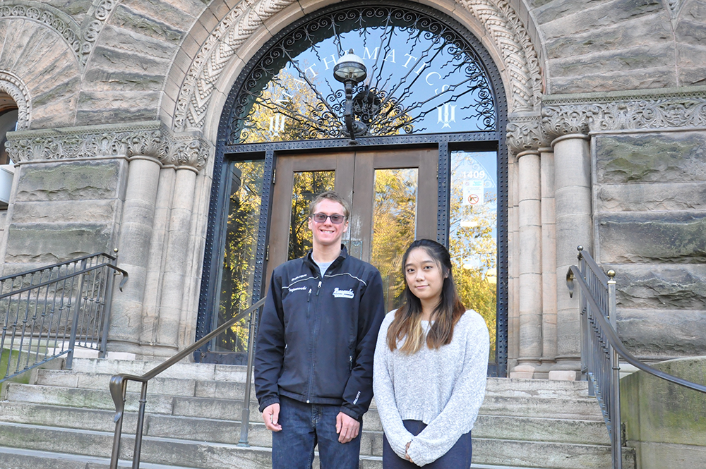 Lucas Trojanowski and Clara Yam pose in front of Altgeld Hall. They are among several high-achieving mathematics students who received reconfigured scholarships under a new program at the Department of Mathematics.