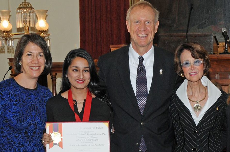 Shivaliben “Shivali” Bhargavkumar Patel, center, poses alongside Illinois Gov. Bruce Rauner as she receives the Lincoln Academy Student Laureate Award. (Photo courtesy of the Office of the Governor.) 
