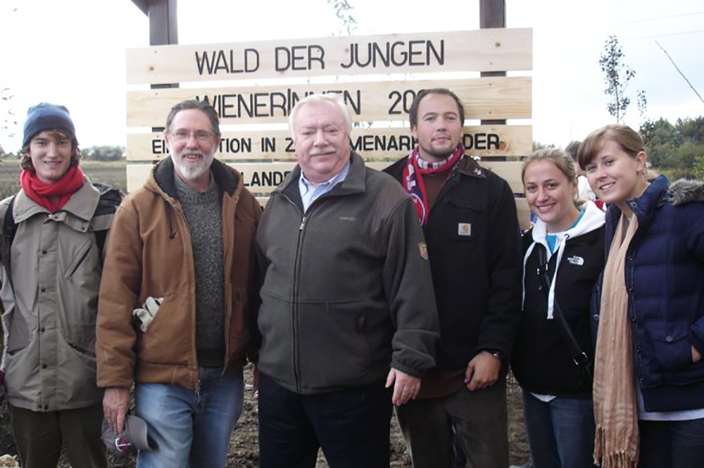 Bruce Murray, second from left, poses with Vienna Mayor Michael Häupl, center, during a reforestation event near the Austrian city in 2009. (Photo courtesy of Bruce Murray.) 