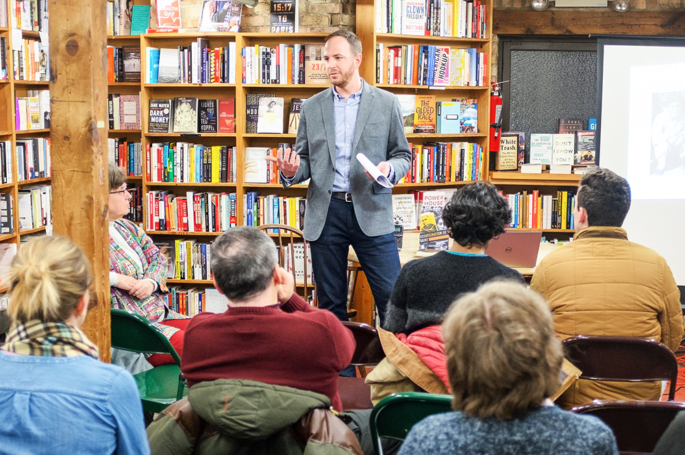 Matt Eisenbrandt speaks at a book signing in Chicago for his book, “Assassination of a Saint.” (Image courtesy of Matt Eisenbrandt.) 