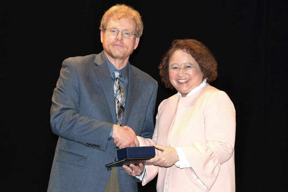 Mei-Po Kwan received the American Association of Geographers (AAG)Ã¢ÂÂs  Stanley Brunn Award for Creativity in Geography, at the AAG 2018 Annual Meeting in New Orleans. She received the  award from AAG President Derek Alderman. (Photo courtesy of American Association of Geographers.) 