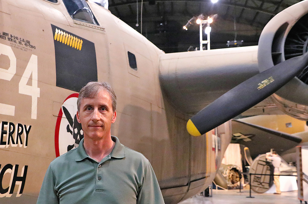 Scott Althaus with a B-24D Ã¢ÂÂ the same model of the bomber on which his relative was lost in World War II Ã¢ÂÂ at the National Museum of the Air Force at Wright-Patterson Air Force Base in Dayton, Ohio. (Photo by Kyra Althaus.) 