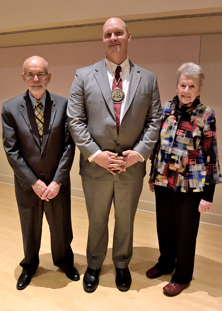 Chad Rienstra, center, has been named the John Witt Professor of Chemistry. John Witt and his wife, Margaret, posed with Rienstra for a photo at the ceremony. (Photo by Lou McClellan.) 